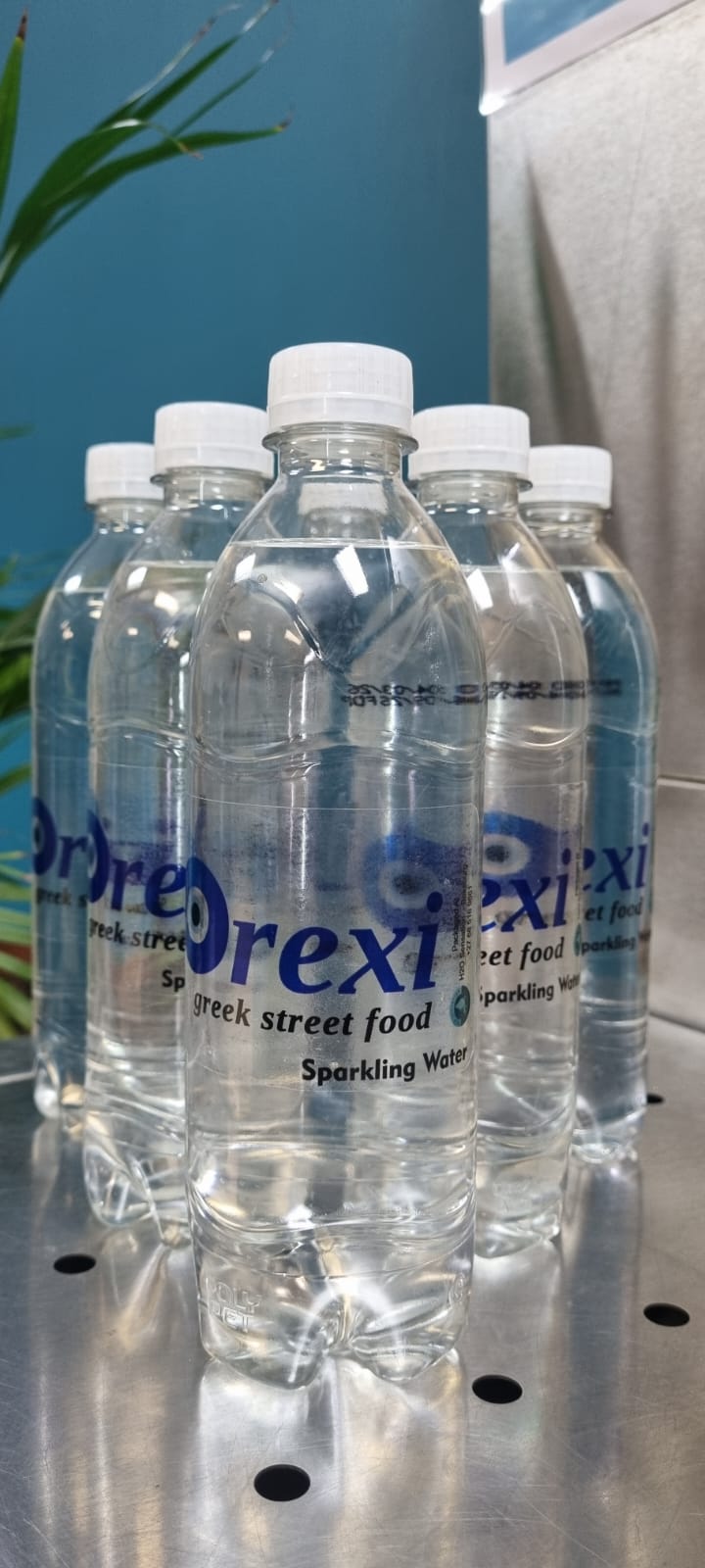 Orexi branded sparkling water bottles