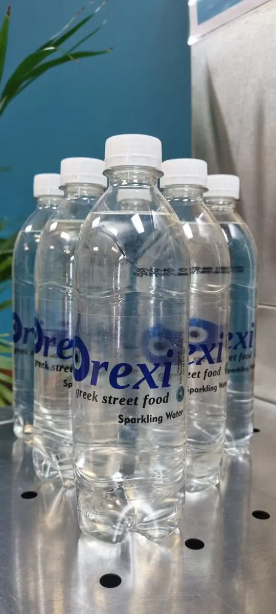 Orexi branded sparkling water bottles